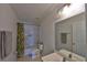 Bathroom with a tub-shower combination and a vanity with a large mirror at 1750 Morning Sky Dr, Winter Garden, FL 34787