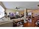 Spacious living room showcasing hardwood floors, neutral walls, bright windows and seamless access to dining at 1750 Morning Sky Dr, Winter Garden, FL 34787