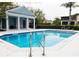 Community pool with a covered gazebo and beautiful blue water at 1750 Morning Sky Dr, Winter Garden, FL 34787