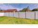 View of the grassy backyard with a well-maintained white fence at 193 Lansbrook Ct, Ocoee, FL 34761