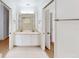 Well lit bathroom with dual sinks, large mirror, and neutral colors at 193 Lansbrook Ct, Ocoee, FL 34761
