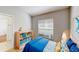 Bright bedroom with a sunny window, closet and light wood floors at 193 Lansbrook Ct, Ocoee, FL 34761