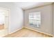 Clean bedroom with a sunny window, closet and light wood floors at 193 Lansbrook Ct, Ocoee, FL 34761