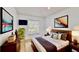 Comfortable bedroom boasts a plush bed, stylish decor, and plenty of natural light at 193 Lansbrook Ct, Ocoee, FL 34761