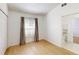 Clean bedroom with a sunny window, closet and light wood floors at 193 Lansbrook Ct, Ocoee, FL 34761