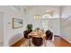 Formal dining room featuring modern decor, a stylish rug, and plenty of natural light at 193 Lansbrook Ct, Ocoee, FL 34761