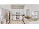 Bright kitchen with stainless steel appliances, granite countertops, and white cabinetry at 193 Lansbrook Ct, Ocoee, FL 34761