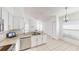 Open concept kitchen with white cabinets, granite countertops, and views into the living space at 193 Lansbrook Ct, Ocoee, FL 34761