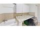 Laundry room includes washer, dryer, counter space, and tiled backsplash at 193 Lansbrook Ct, Ocoee, FL 34761