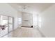 Bright and airy living room boasts tile flooring, a modern entertainment center, and access to the outdoor patio at 193 Lansbrook Ct, Ocoee, FL 34761