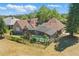 Aerial view of the backyard with screened-in pool and brick home at 20705 Nettleton St, Orlando, FL 32833