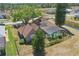 Aerial view of a brick home with fenced backyard, screened-in pool at 20705 Nettleton St, Orlando, FL 32833