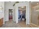 Walk-in closet offering ample storage space, accessible from the Primary bath, features custom shelving at 20705 Nettleton St, Orlando, FL 32833