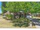 Charming brick home with a large, mature tree providing ample shade and curb appeal at 20705 Nettleton St, Orlando, FL 32833
