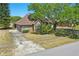 Ranch home with a spacious driveway and well-maintained landscaping and mature shade tree at 20705 Nettleton St, Orlando, FL 32833