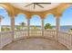 Spacious balcony features decorative pillars and railings with amazing views of the water at 225 Magnolia St, Windermere, FL 34786