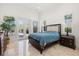 Bright primary bedroom with marble floors and access to the outdoors at 225 Magnolia St, Windermere, FL 34786