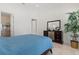 Bright bedroom featuring ensuite bathroom and outdoor views at 225 Magnolia St, Windermere, FL 34786