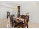 Elegant dining room showcasing a modern elevator and marble floors at 225 Magnolia St, Windermere, FL 34786