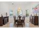 Dining room with chandelier, large windows overlooking waterfront at 225 Magnolia St, Windermere, FL 34786
