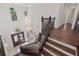 Stunning foyer featuring a grand chandelier and a staircase with dark wood railings at 225 Magnolia St, Windermere, FL 34786