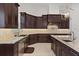 Gourmet kitchen featuring custom cabinetry, granite countertops, and a stylish tile backsplash at 225 Magnolia St, Windermere, FL 34786