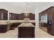 Gourmet kitchen with custom cabinets, island, and stainless steel appliances at 225 Magnolia St, Windermere, FL 34786