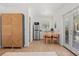Bright kitchen features stainless steel appliances, stylish wood cabinets, and dining area at 225 Magnolia St, Windermere, FL 34786