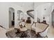 Elegant living space with marble floors, archways, ornate furniture, and access to other living spaces at 225 Magnolia St, Windermere, FL 34786