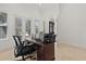 Bright office with travertine floors, French doors, and a work desk at 225 Magnolia St, Windermere, FL 34786