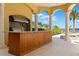 Outdoor kitchen featuring high-end appliances with water views at 225 Magnolia St, Windermere, FL 34786
