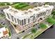 An aerial view of the condo building on the Manatee River with outdoor patio seating at 225 W Seminole Blvd # 409, Sanford, FL 32771