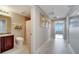 This bathroom features a tiled floor and shower, toilet and a vanity with sink at 225 W Seminole Blvd # 409, Sanford, FL 32771