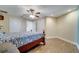 This bedroom features wood floors, ceiling fan and ample closet space at 225 W Seminole Blvd # 409, Sanford, FL 32771