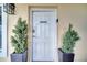 A door to the clubhouse, framed by planters at 225 W Seminole Blvd # 409, Sanford, FL 32771