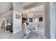 Stylish dining room with a modern chandelier, a sleek white table, and marble tile floor at 225 W Seminole Blvd # 409, Sanford, FL 32771
