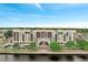Stunning waterfront complex featuring colorful architecture and lush landscaping at 225 W Seminole Blvd # 409, Sanford, FL 32771