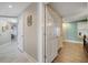 Hallway with access to bathroom and bedrooms features tile flooring and neutral paint at 225 W Seminole Blvd # 409, Sanford, FL 32771
