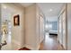 Hallway leading into the primary bedroom which features natural light and balcony access at 225 W Seminole Blvd # 409, Sanford, FL 32771