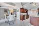 Bright, modern kitchen featuring granite countertops, stainless steel appliances, and a marble tile floor at 225 W Seminole Blvd # 409, Sanford, FL 32771