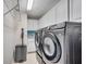 A functional laundry room featuring new appliances and ample storage space at 225 W Seminole Blvd # 409, Sanford, FL 32771