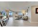Bright living room with tile floors and sliding glass doors to the balcony at 225 W Seminole Blvd # 409, Sanford, FL 32771