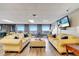 Inviting living room features two plush sofas, large windows, and a modern entertainment setup at 225 W Seminole Blvd # 409, Sanford, FL 32771