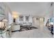 Inviting living space featuring neutral tones, comfortable furniture, and access to other living areas at 225 W Seminole Blvd # 409, Sanford, FL 32771