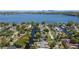 Scenic aerial view of waterfront community featuring canals and access to the expansive lake at 2601 Windward Ct, Orlando, FL 32805