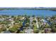 Scenic aerial view of a waterfront community featuring canals with access to the expansive lake at 2601 Windward Ct, Orlando, FL 32805