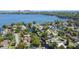 Stunning aerial view of canal-lined homes with easy access to the expansive lake at 2601 Windward Ct, Orlando, FL 32805