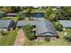 Aerial view of a single-Gathering home with well-kept landscaping and a waterfront view at 2601 Windward Ct, Orlando, FL 32805