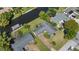 Waterfront home featuring boat dock and easy access to waterways, set amongst mature trees and landscaping at 2601 Windward Ct, Orlando, FL 32805