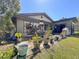 Backyard patio area with outdoor furniture and lots of greenery at 2601 Windward Ct, Orlando, FL 32805